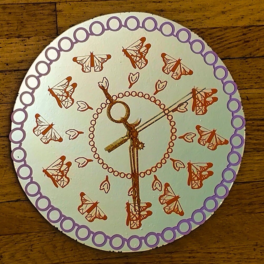butterfly mirror clock